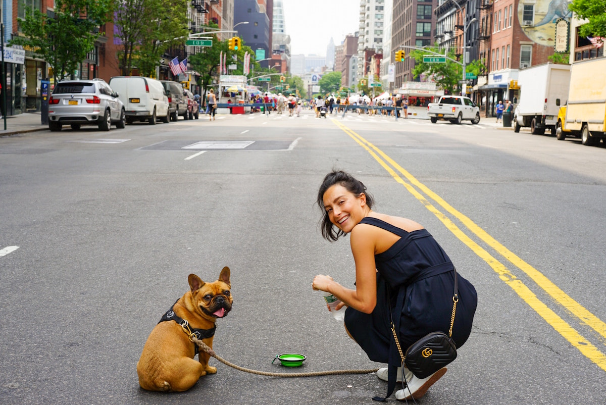 woman and her dog in the city