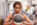 woman holding medicine ball at gym