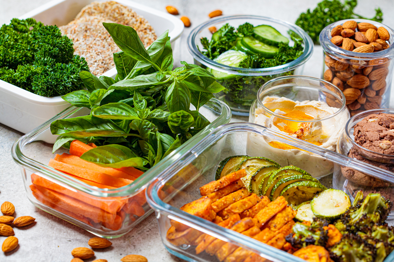 Glass meal-prep containers full of food. Find out how to start meal prepping at home.