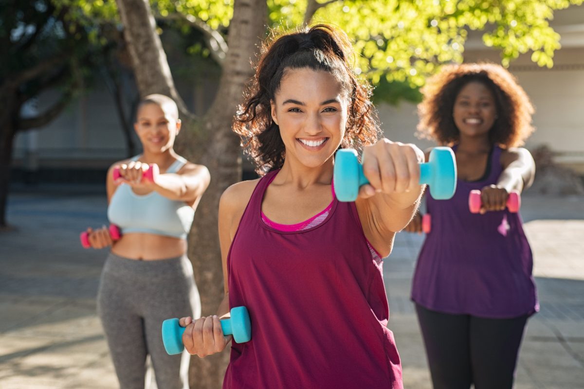 Health coach leading women in a workout. Discover the private membership community for wellness entrepreneurs looking for more visibility, referrals, and peer support at GloWell.